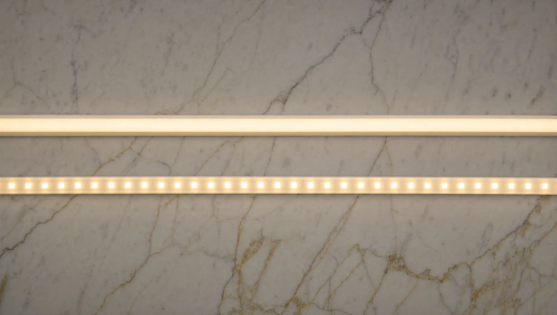 COB and SMD LED strips lit side by side on marble