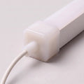 Front cable-entry cap for 15x15mm LED neon flex, soft opal silicone with extended outlet, light grey background