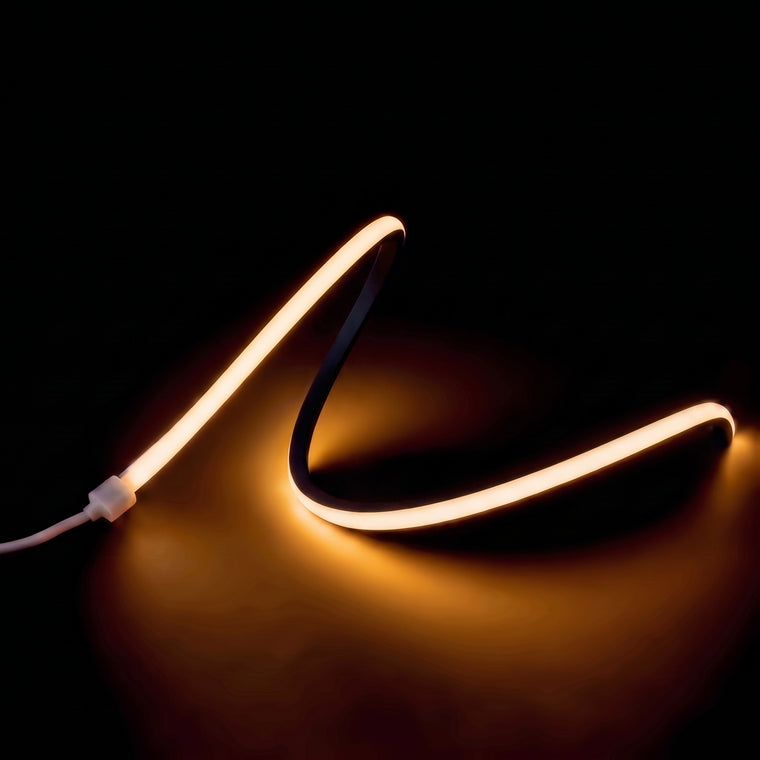 Warm White 2700K LED Neon Flex 15x15mm Top Bend 24V/48V, raised-wave product view on a dark surface
