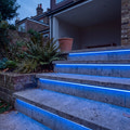 Blue 15x15mm Top Bend LED neon flex in an outdoor recessed garden step lighting illustration.