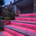 Pink 15x15mm Top Bend LED neon flex in an outdoor recessed garden step lighting illustration.