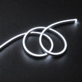 ATOM LED cool white 8×16mm 220–240V neon flex in a double-loop arrangement on dark charcoal