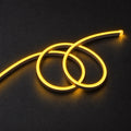 ATOM LED golden 8×16mm 220–240V neon flex in a double-loop arrangement on dark charcoal