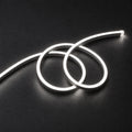 ATOM LED natural 4000k 8×16mm 220–240V neon flex in a double-loop arrangement on dark charcoal