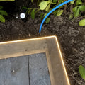 2700K neon flex light along a timber garden edge; colour-adjusted installation illustration