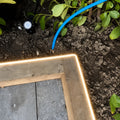 3000K neon flex light along a timber garden edge; colour-adjusted installation illustration