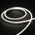 4000K horizontal-bend neon flex coil on dark charcoal with soft surface illumination; colour-adjusted product photograph