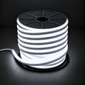 Cool white 6000K 8×16mm 220–240V wireless IP65 LED neon flex lit reel with end cap and cable on dark charcoal