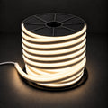 Warm white 8×16mm 220–240V wireless IP65 LED neon flex lit reel with end cap and cable on dark charcoal
