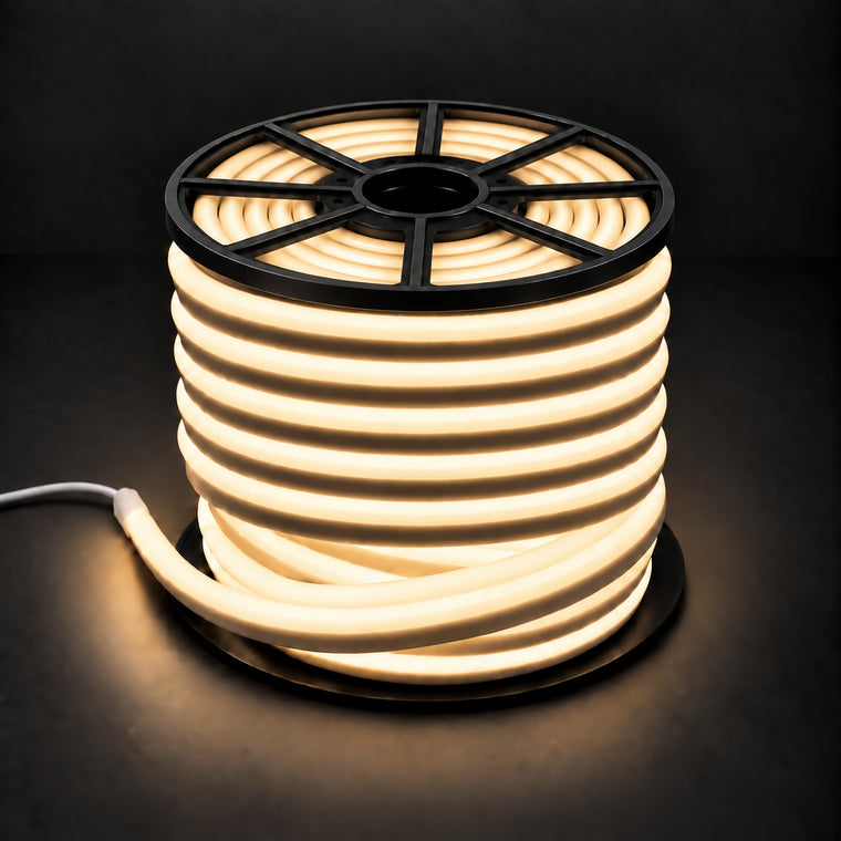 Warm white 8×16mm 220–240V wireless IP65 LED neon flex lit reel with open-spoke black top, visible light inside, end cap and cable on dark charcoal