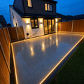 Cool White 6000K 10x20mm 48V IP67 LED neon flex framing a patio beside bifold doors at dusk — ATOM LED
