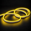 6x12mm LED neon flex with Lemon Yellow illumination in overlapping loops on a dark charcoal surface.
