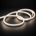 6x12mm LED neon flex with Natural White 4000K illumination in overlapping loops on a dark charcoal surface.