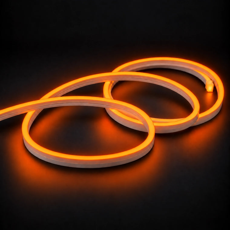 6x12mm LED neon flex with Orange illumination in overlapping loops on a dark charcoal surface.