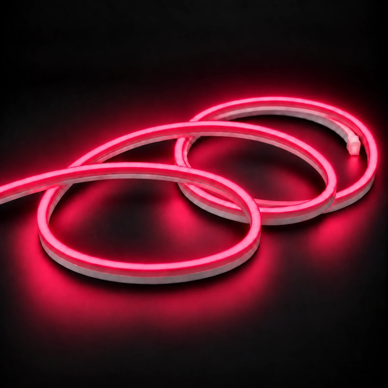 Rose Red neon flex with a coloured diffuser and white silicone sides, arranged in overlapping loops on dark charcoal.