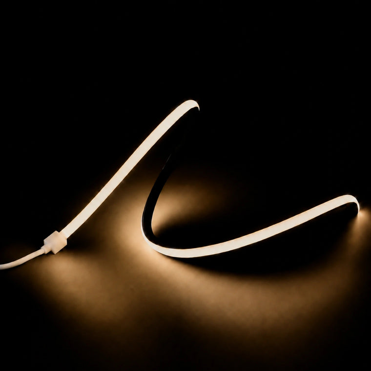 Warm white 3000K 15x15mm top bend LED neon flex 24V illuminated on a black background