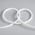 Unlit white 4x10mm FreeCut mini neon flex showing its slim silicone body and flexible loops — illustration