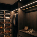 Mini neon flex recessed into shelf edges in a fitted wardrobe