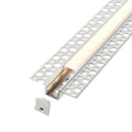 Plaster-in LED profile lit warm white with end cap alongside