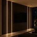 Black 12x10mm LED profile lit in acoustic wall panelling beside a television