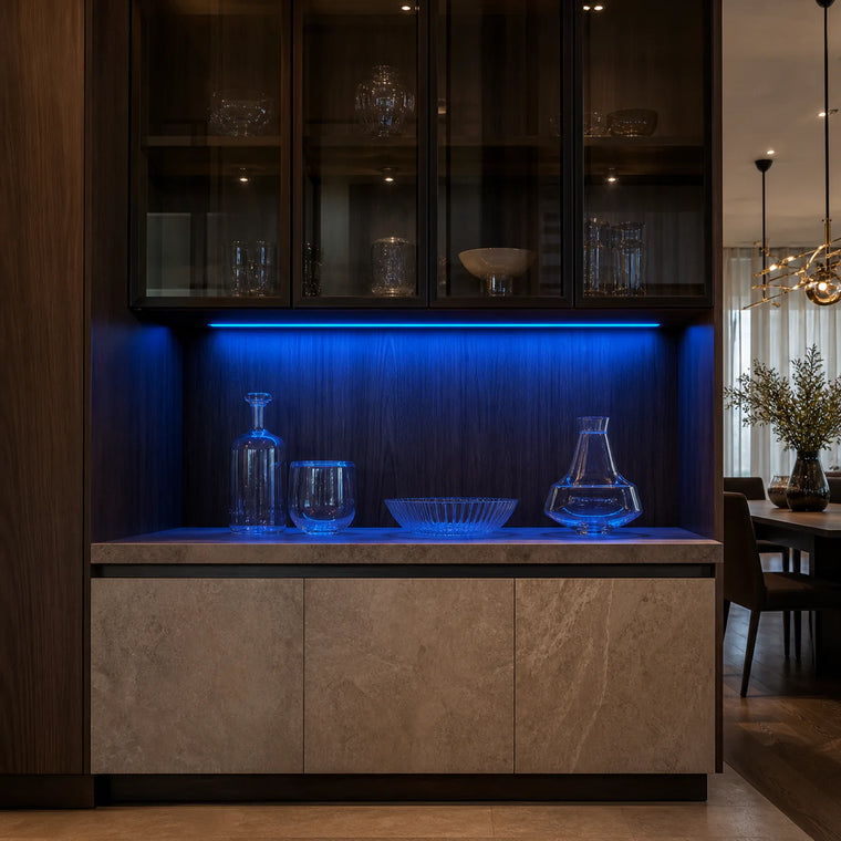 Blue kitchen cabinet SCOB LED strip installed in a modern glass display cabinet — illustrative interior