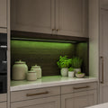 Green kitchen cabinet SCOB LED strip installed in a modern pantry niche — illustrative interior