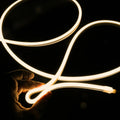 ATOM LED warm white 3000K 10x10mm side bend neon flex bending flat around an outdoor flower border — 48V IP67 waterproof