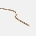 Bendable aluminium mounting profile with LED neon flex installed in a S-shaped curve on a pale grey background