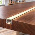 Black 30x20mm silicone profile recessed in walnut with 3000K COB LED tape, switched on - installation illustration