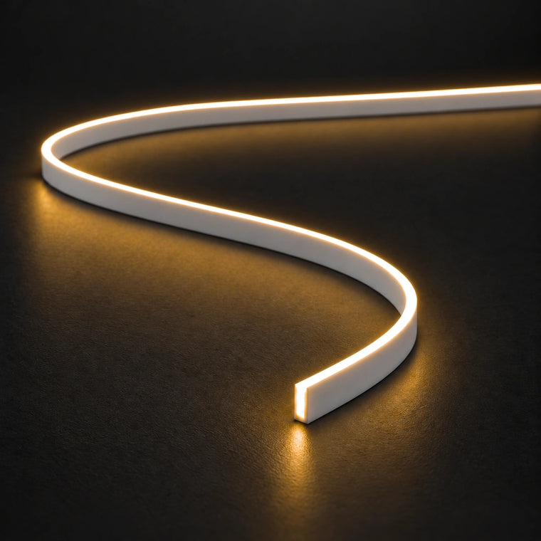 4x10mm FreeCut mini neon flex in warm white 2700K, curved on a dark surface — illustration