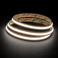 4000K Free Cut COB LED strip 24V 8mm IP20 illuminated coil on black background