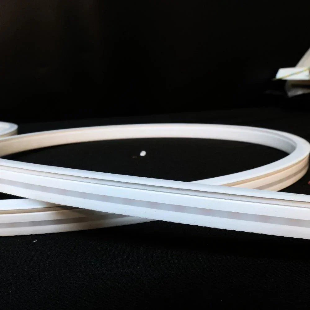 Natural White 4000K 8x16mm 24V neon flex — bend radius demonstration on signage curve