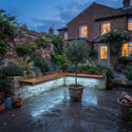 Icy blue-white RGB mixed light recessed beneath an outdoor courtyard bench