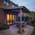 Blue RGB neon flex recessed underneath the roof beams of a sheltered UK patio