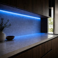 Illustrative indoor under-cabinet installation showing Blue SCOB LED strip lighting