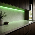 Illustrative indoor under-cabinet installation showing Green SCOB LED strip lighting