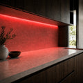 Illustrative indoor under-cabinet installation showing Red SCOB LED strip lighting