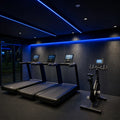 Blue SCOB LED strip lighting installed in a modern cardio area — illustrative interior