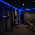 Blue SCOB LED strip lighting installed in a modern gym — illustrative interior