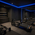 Blue SCOB LED strip lighting installed in a modern Pilates studio — illustrative interior