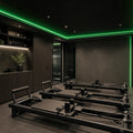 Green SCOB LED strip lighting installed in a modern Pilates studio — illustrative interior