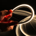 Warm White 3000K 10x10mm dual bend neon flex close-up — IP67 silicone body