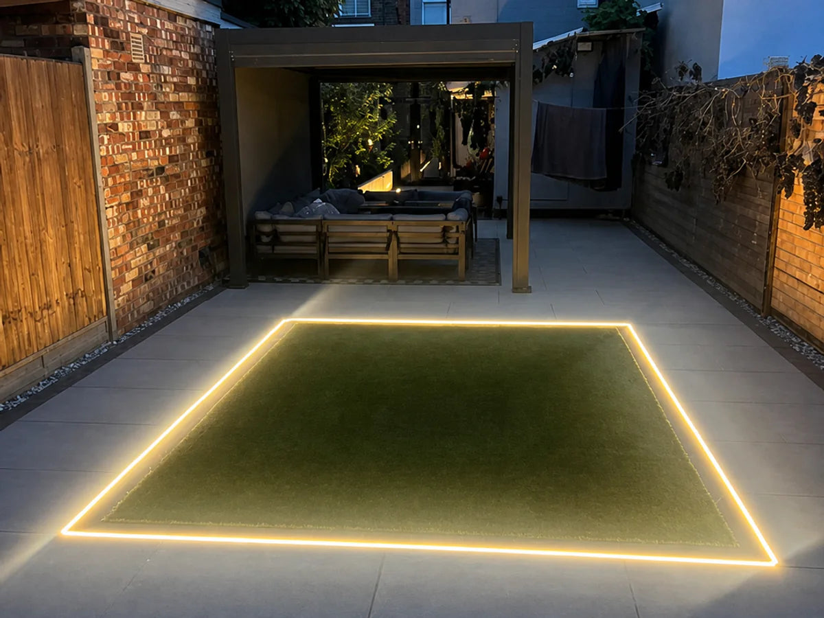 Recessed warm white 3000K neon flex outlining a central garden feature