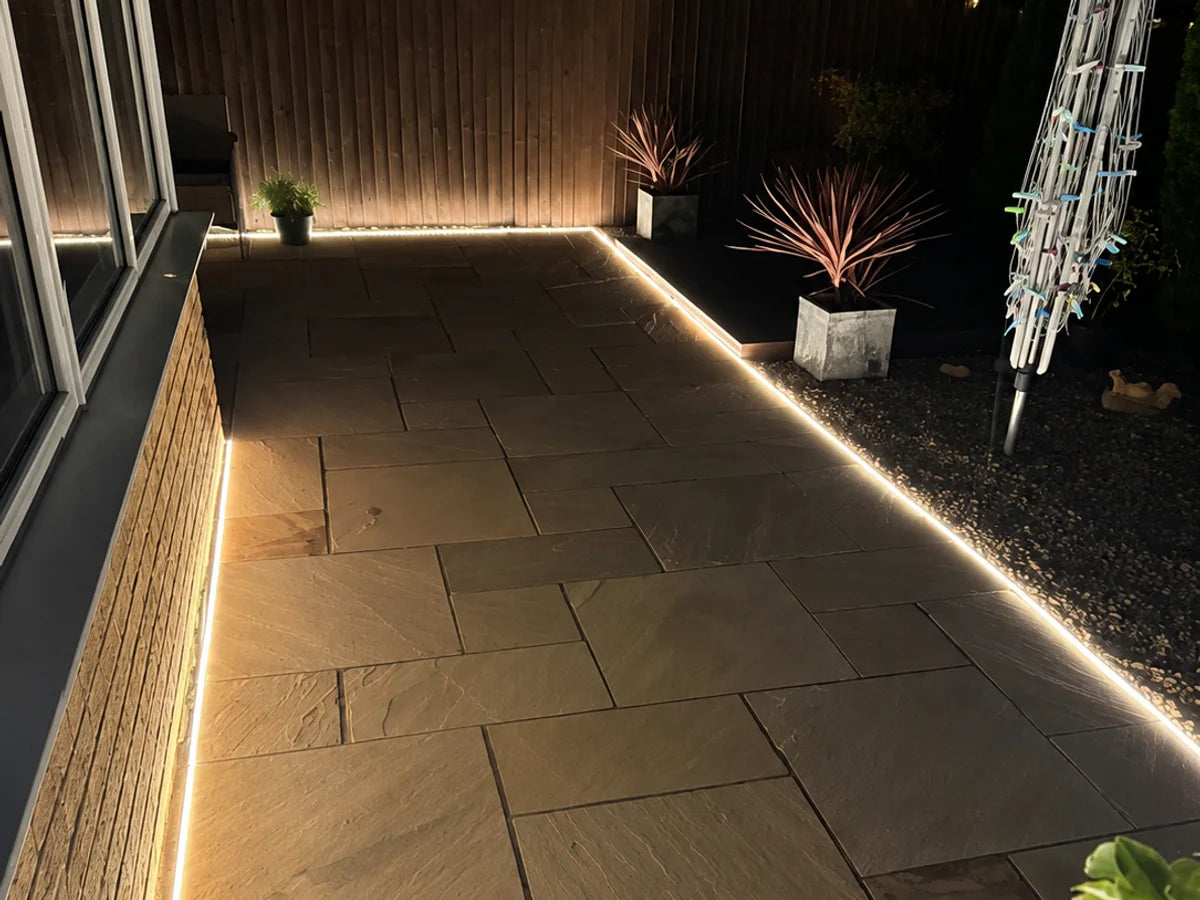 Recessed 3000K neon flex defining a garden path and planting edge