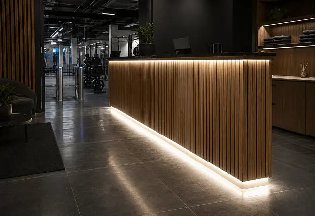 Gym reception desk and shelving with recessed warm-white COB LED lighting